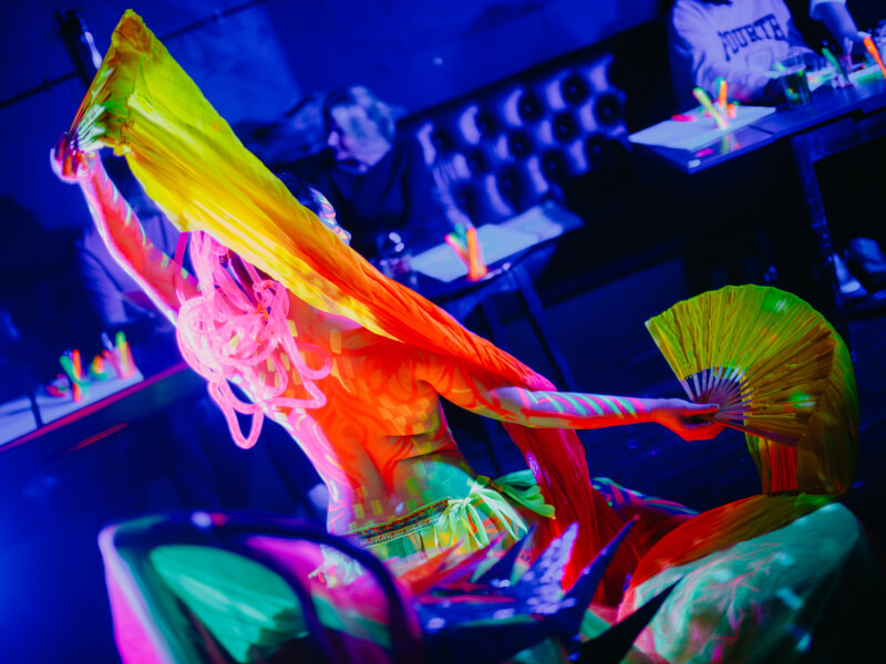Woman posing at a neon life drawing class